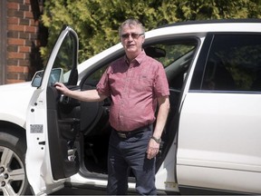Ray Gartner, who has been volunteering with Meals on Wheels since 1995, stands by his vehicle on his driveway in Regina on Friday, May 15, 2020.