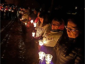 More than 250 people attended a candlelight vigil in the northern community of La Ronge on Nov. 1, 2016 to remember six young girls who recently lost their lives to suicide.
