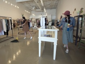 Nicolette, left, and Nicole Hunter, sister-in-laws and owners of Nico Lady + Baby, clean the store and are getting things ready to open in phase 3 . Photo taken in Regina on Friday, May 29, 2020.