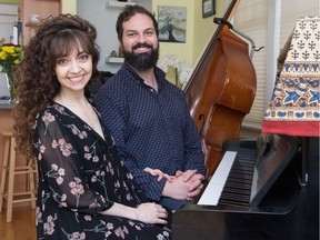 Musicians Katherine Dowling, left, and Clark Schaufele sit at the piano in their home in Regina on May 12, 2020.