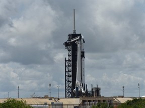 The SpaceX Crew Dragon spacecraft sits atop a Falcon 9 booster rocket on Pad39A at the Kennedy Space Center in Cape Canaveral, Fla., Friday, May 29, 2020.