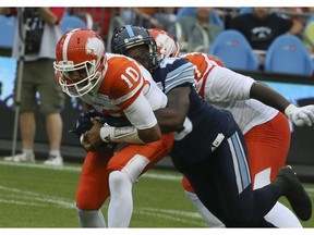Nakas Onyeka (right), shown tackling B.C. Lions quarterback Jonathon Jennings during the 2017 CFL season, signed with the Riders on Tuesday after three seasons with the Toronto Argonauts.