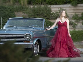 Luther College High School grade 12 student Hope Van Vlliet poses with their family owned Chevrolet Nova SS convertible in Regina on Tuesday, June 16, 2020.