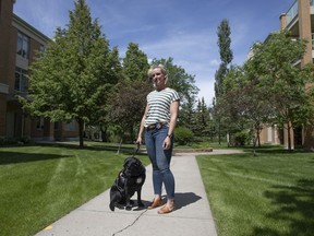 BEST PHOTO REGINA, SASK.: JUNE 23, 2020-  Sgt. Tia Froh and Merlot, a trained justice facility dog that helps victims with emotional support, stand for portrait by Central Park in Regina , Tuesday, June, 23, 2020. Kayle Neis/Regina Leader-Post