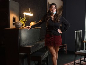 Kelly Cairns, a co-owner of the staff-owned restaurant and venue The Cure, stands near the piano in the venue on 11th Avenue in Regina. The restaurant is reopened at half capacity, and Cairns is hoping to be able to host ticketed shows there, which is currently not allowed due to the COVID-19 pandemic.