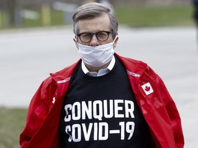 John Tory, Toronto's mayor, wears a protective mask as he arrives at an event to give out meals provided by Maple Leaf Sports & Entertainment (MLSE) to healthcare workers outside Centenary Hospital in Toronto, April 24, 2020.