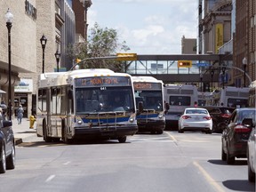 A large collection of City of Regina transit buses on 11th Avenue just east of Lorne Street in Regina on Monday, July 6, 2020.