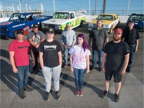 Members of the Fink family, all or whom are involved in stock-car racing in some capacity, stand in front of their fleet of race cars at Kings Park Speedway. Front row (left to right): Jeff, Riley, Shelby and Greg Fink. Standing (left to right): Chuck, Morris, Kevin and Oliver Fink.