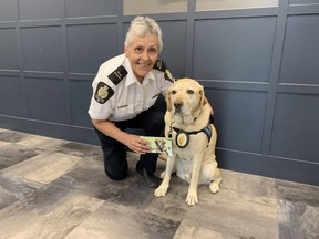 Donna Blondeau, Victim Services co-ordinator with the Moose Jaw Police Service, and her canine partner Police Service Dog Kane. Blondeau has written a book entitled Kane's Tale so children know Kane is there to help.