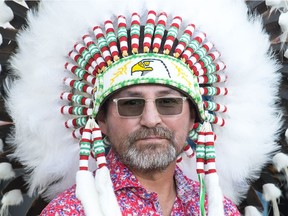 PIAPOT FIRST NATION, SASK : July 23, 2020  -- Newly-minted Piapot First Nation chief Mark Fox wears his headdress at an inauguration ceremony for the new chief and council of Piapot on the reserve's powwow grounds on July 23, 2020.  BRANDON HARDER/ Regina Leader-Post