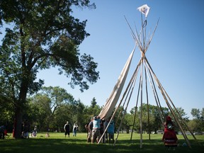 REGINA, SASK : July 31, 2020  -- People set up a teepee in Wascana Park across from the Saskatchewan Legislative Building in Regina, Saskatchewan on July 31, 2020. BRANDON HARDER/ Regina Leader-Post