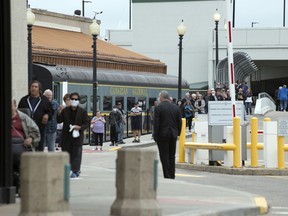 A long line of people waited in line just before 9:00am as Casino Regina reopened for the first time since closing due to the COVID-19 pandemic in Regina on Thursday, July 9, 2020.