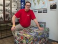 Mark Gilchrist, Legion member and VetBuild program leader, kneels behind a collection of donated models that will be used for the VetBuild program, kicking off next Wednesday, which is a weekly program where veterans, former RCMP and their family members can gather to build scale models. He is pictured here inside the Royal Canadian Legion Regina Branch building on Cornwall Street in Regina, Saskatchewan on July 21, 2020.