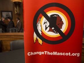 A poster for the "Change the Mascot" campaign is seen prior to a press conference by the Oneida Indian Nation leaders on Capitol Hill in Washington, DC, September 16, 2014.