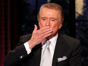 Television host Regis Philbin blows a kiss goodbye during his final show of "Live With Regis and Kelly" in 2011.