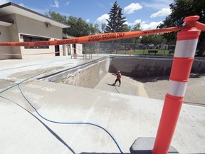 Crews from WozBuilt Wet Blasting work with Mans Garage construction, who is the general contractor, at Dewdney Pool in Regina on Tuesday, July 14, 2020. Dewdney Pool is closed for the season as it is being repaired.