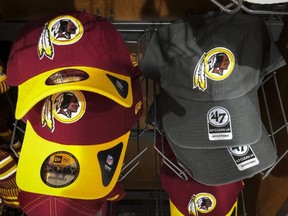 Redskins hats sit for sale at a sporting goods store in Washington, D.C., on Tuesday, July 7, 2020.