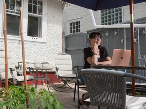 Author Dianne Warren sits in the back yard of her home in Regina, Saskatchewan on June 12, 2020.