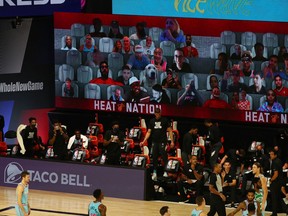 Virtual fans — including a dog — are part of the equation as NBA teams, such as the Miami Heat and Boston Celtics, operate in a bubble due to COVID-19.