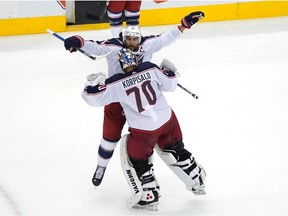 Nick Foligno of the Columbus Blue Jackets congratulates goaltender Joonas Korpisalo, 70, after Sunday's 2-0 NHL shutout of the Toronto Maple Leafs.