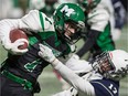 The Martin Monarchs' Adam Husli, left, fends off a tackle by the Greenall Griffins' Tate Olson during a Regina Intercollegiate Football League game at Mosaic Stadium last season.