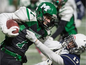 The Martin Monarchs' Adam Husli, left, fends off a tackle by the Greenall Griffins' Tate Olson during a Regina Intercollegiate Football League game at Mosaic Stadium last season. The start of the 2020 season is on hold due to COVID-19.