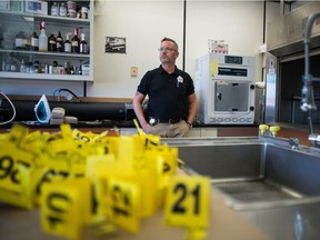 Cpl. Keith Malcolm of the Regina Police Service Forensic Identification Unit, stands in the force's forensics lab at police headquarters in Regina, Saskatchewan on August 6, 2020.