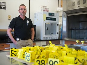 Cpl. Keith Malcolm of the Regina Police Service Forensic Identification Unit, stands in the force's forensics lab at police headquarters  in Regina, Saskatchewan on August 6, 2020.