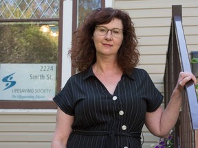 Shelby Rushton, CEO of Lifesaving Society, Saskatchewan branch, stands in front of the branch office on Smith Street in Regina, Saskatchewan on August 6, 2020.