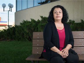 Stephanie O'Soup, coordinator for the Victim Services Unit of the Regina Police Service, sits in front of police headquarters in Regina, Saskatchewan on August 17, 2020.