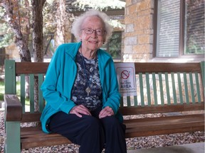 Jean Mountain sits outside of the front entrance to her seniors complex in Regina on Aug. 17, 2020.
