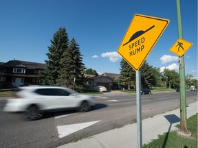 A speed hump sign is shown on Whelan Drive near MacNeil School in Regina, Saskatchewan on August 21, 2020. The city intends to install what it calls traffic calming curbs at the location, with work beginning August 24, with the removal of the existing speed humps. The calming curbs are to be installed August  25. During the work, motorists will be forced to detour around the area.  BRANDON HARDER/ Regina Leader-Post