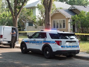 Police work at the scene of a death investigation on the 1200 block of Cameron Street in Regina, Saskatchewan on August 25, 2020.