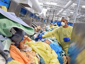 An employee pictured working at K-Bro Linens in Regina in 2016.