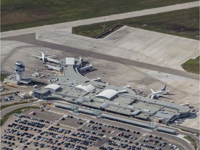 The province of Saskatchewan says a rise in active COVID-29 case is linked to interprovincial travel by both air and road. Saskatoon's John G. Diefenbaker International Airport is seen in this Sept. 13, 2019 aerial photo.