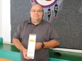 Peepeekisis Cree Nation operations director Ernest Standingready holds a modular node from Mage Networks, used to relay an Internet signal from his community's school to students' homes on the First Nation on Sept. 3, 2020.