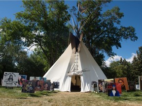Photos of northern residents lost to suicide surround Tristen Durocher's teepee in Wascana Park on Sept. 4, 2020.