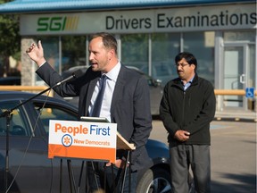 Saskatchewan NDP leader Ryan Meili speaks at a news conference in the parking lot of the SGI examinations centre in Regina, Saskatchewan on Sept. 10, 2020. The New Democrats are suggesting that what they say is a surplus of funds being held by SGI should be returned to ratepayers directly.
