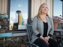 Lisa Miller, executive director of the Regina Sexual Assault Centre, sits in front of the centre's desk.