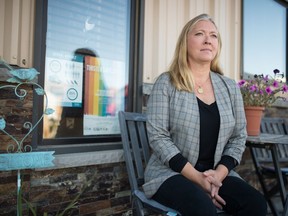 Lisa Miller, executive director of the Regina Sexual Assault Centre, sits in front of the centre's office on MacKay Street in Regina, Saskatchewan on Sept. 10, 2020.