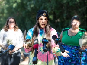 Tristen Durocher speaks to media near his teepee in Wascana Park in Regina, Saskatchewan on Sept. 11, 2020. The court denied the government's application for an order to have the teepee removed for violating park bylaws.