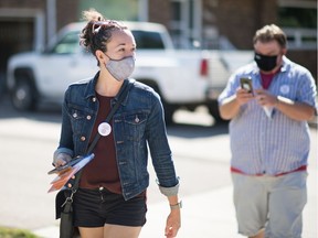 Nicole Sarauer, Saskatchewan NDP candidate for Regina Douglas Park, walks along Lacon Street in Regina, Saskatchewan on Sept. 11, 2020. Sarauer was door knocking in the neighbourhood to generate support for the upcoming provincial election.