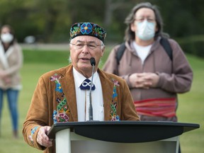 Clément Chartier, at podium, speaks to media regarding Métis hunting rights at the Saskatchewan Legislative Building in Regina, Saskatchewan on Sept. 17, 2020. He says a recent Saskatchewan Court of Appeal decision opens a door for argument on where Métis people can exercise hunting and fishing rights protected by the Charter of Rights and Freedoms.
