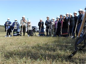 Elders at the Pasqua First Nation northeast of Regina participate in a sod-turning ceremony to mark the beginning of construction for a new elders lodge to be built in the community by September 2021, on Sept. 18, 2020.