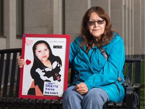 REGINA, SASK : September 18, 2020  -- Dianne BigEagle holds a photo of her daughter Danita in front of Court of Queen's Bench in Regina, Saskatchewan on Sept. 18. 2020. Danita has been missing since 2007. BRANDON HARDER/ Regina Leader-Post