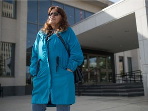 Dianne BigEagle stands in front of Court of Queen's Bench in Regina, Saskatchewan on Sept. 18. 2020. Her daughter Danita has been missing since 2007.