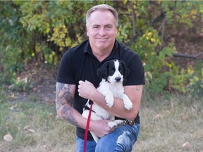 Kelly Munce and his 10-week old English Springer Spaniel, Sasha.