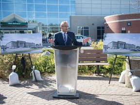 Saskatchewan Health Minister Jim Reiter speaks to media regarding the proposed building of a new "urgent care" health care facility in Regina during a news conference held in front of the Pasqua Hospital in Regina, on Sept. 21, 2020.