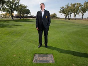 Wascana Country Club CEO Greg Dukart, who is retiring after 40 years in the golf industry, stands in front of a plaque commemorating Brooke Henderson's performance in the 2018 CP Women's Open. The plaque is embedded on the 18th hole.