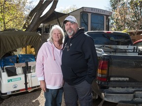 Lorraine Schick, left, and her husband Matt Birg stand in front of their site at Sherwood Forest Country Club near Regina, Saskatchewan on Sept. 30, 2020. The pair normally winters at a property in Arizona, but has been forced to stay in Saskatchewan this year due to restrictions around COVID-19.